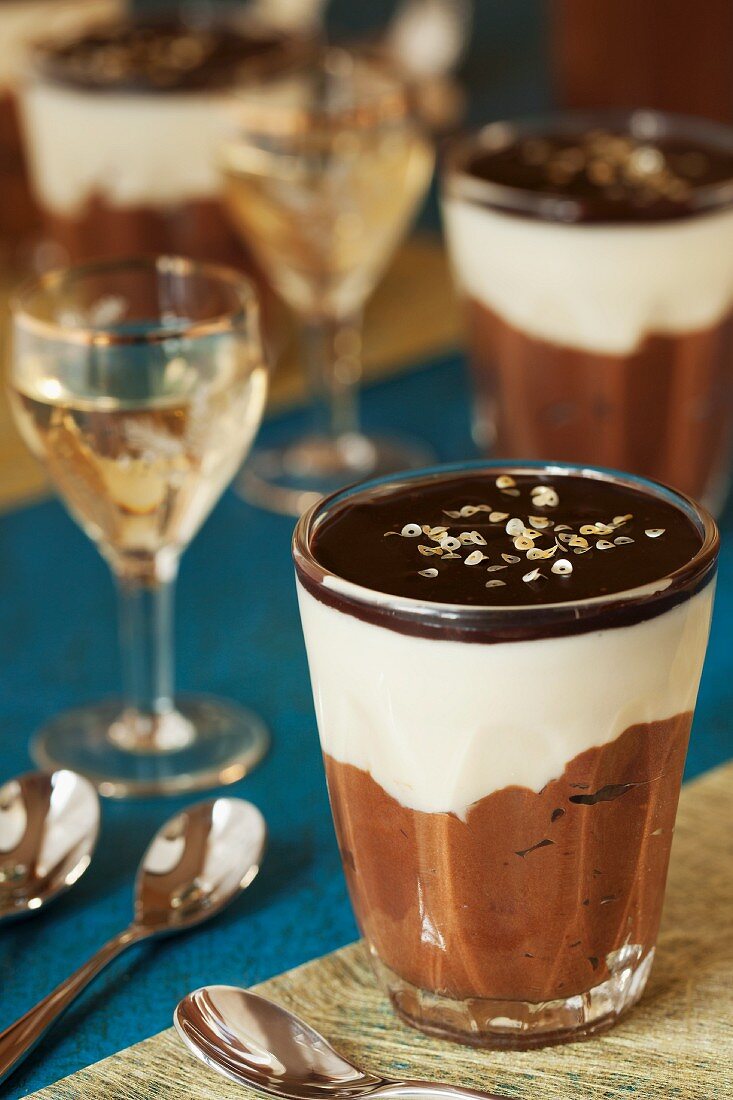 White and dark chocolate mousse with chocolate glaze and gold leaf served with dessert wine
