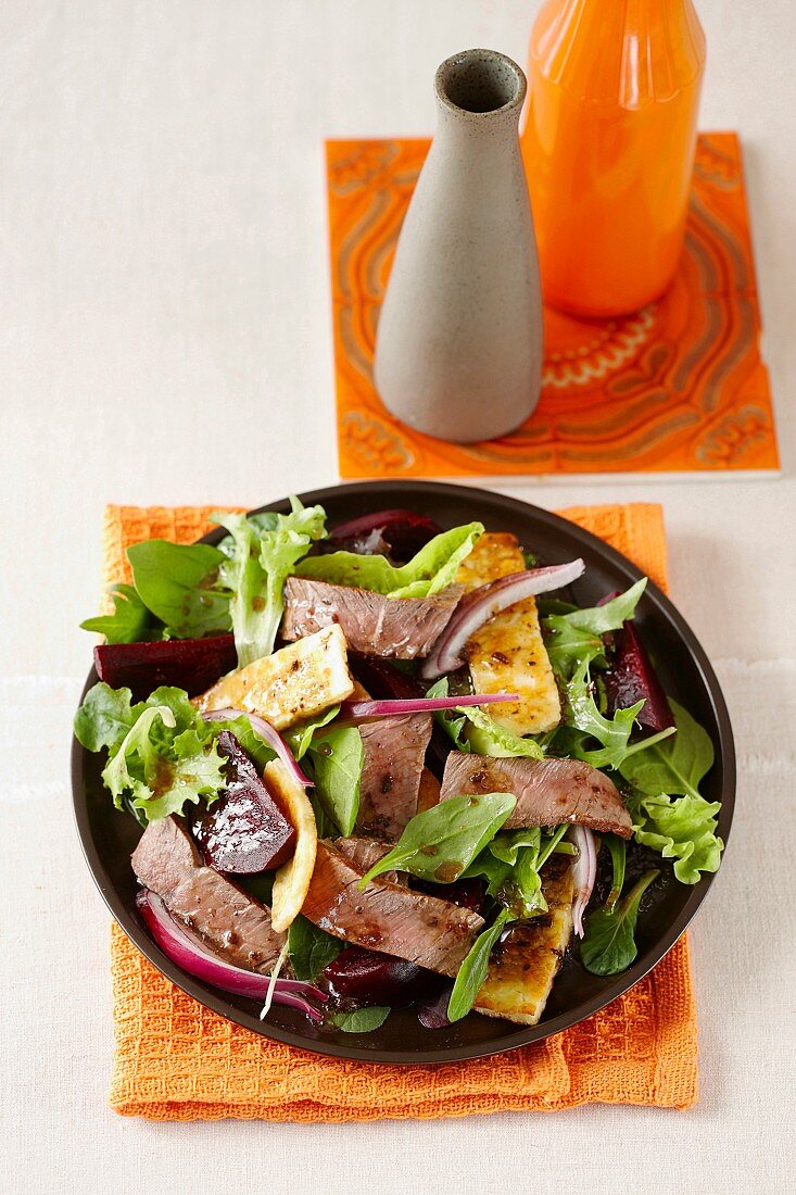 A salad with beef, beetroot and haloumi cheese