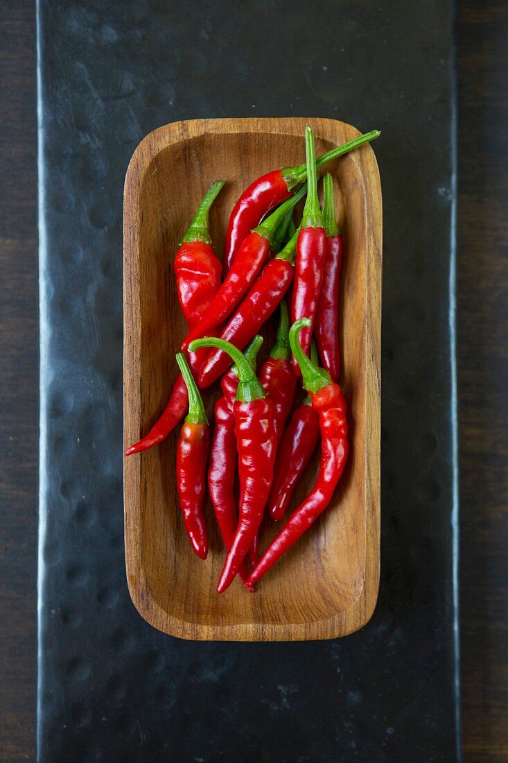 Red chillies in wooden bowl