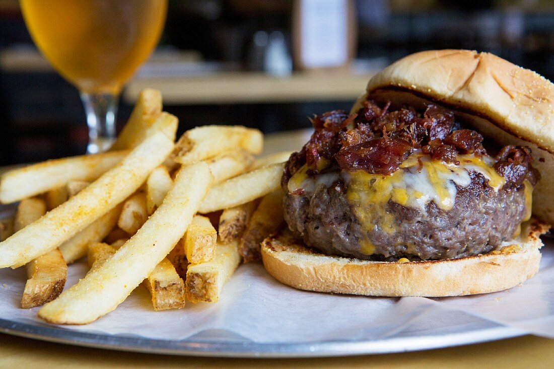 A cheeseburger and chips