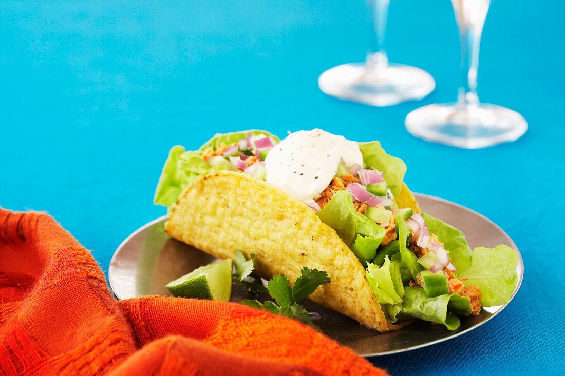 A taco filled with salmon and salad