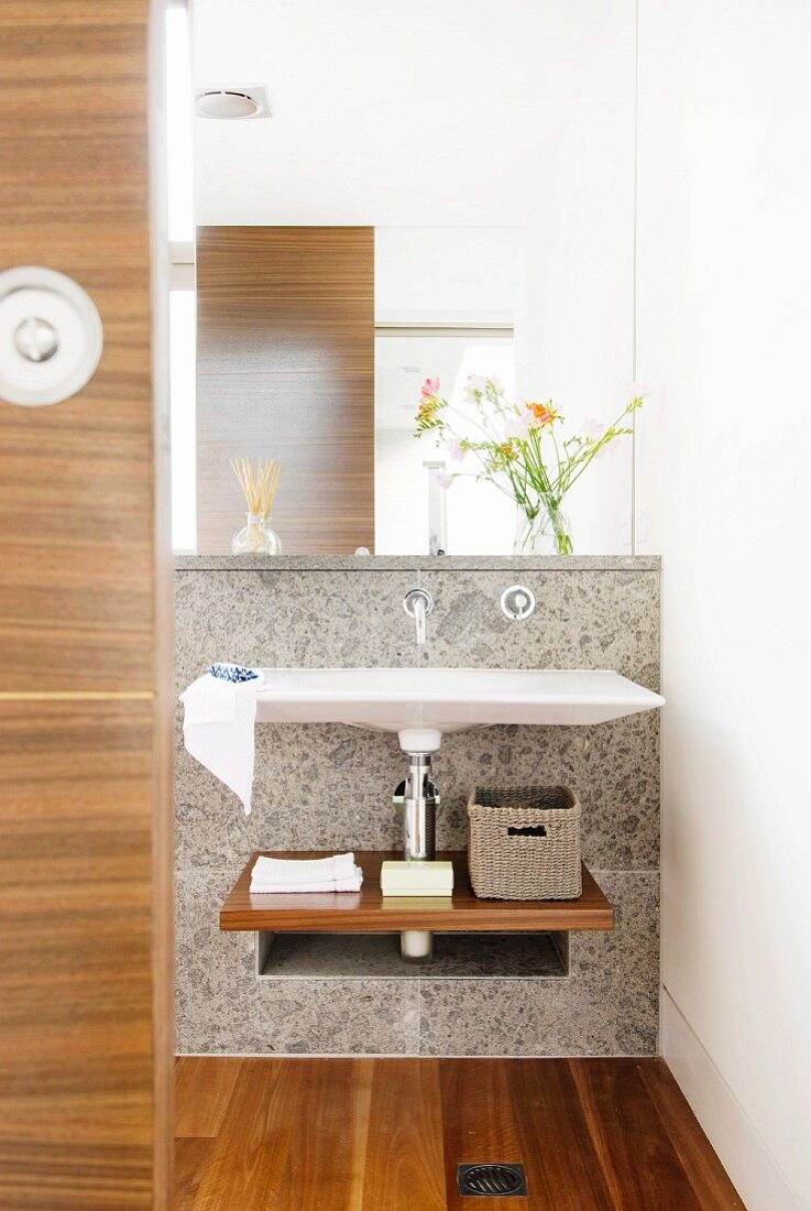 Mirror and elegant washstand in designer bathroom