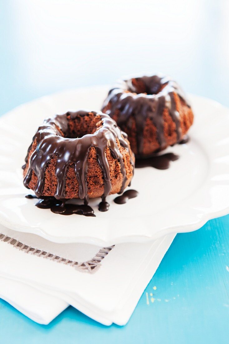 Two mini Bundt cakes with chocolate glaze