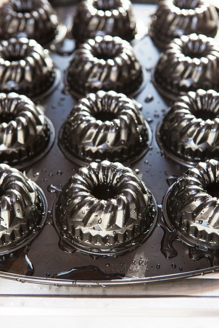 Mini Bundt cake moulds on a baking tray