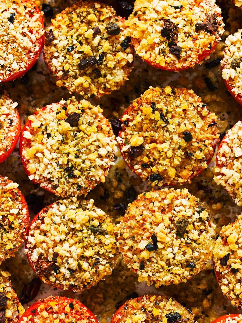 Roasted tomatoes topped with an olive and breadcrumb crust