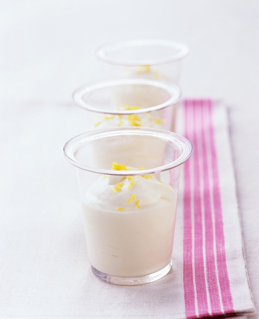Three glasses of lemon and lime mousse