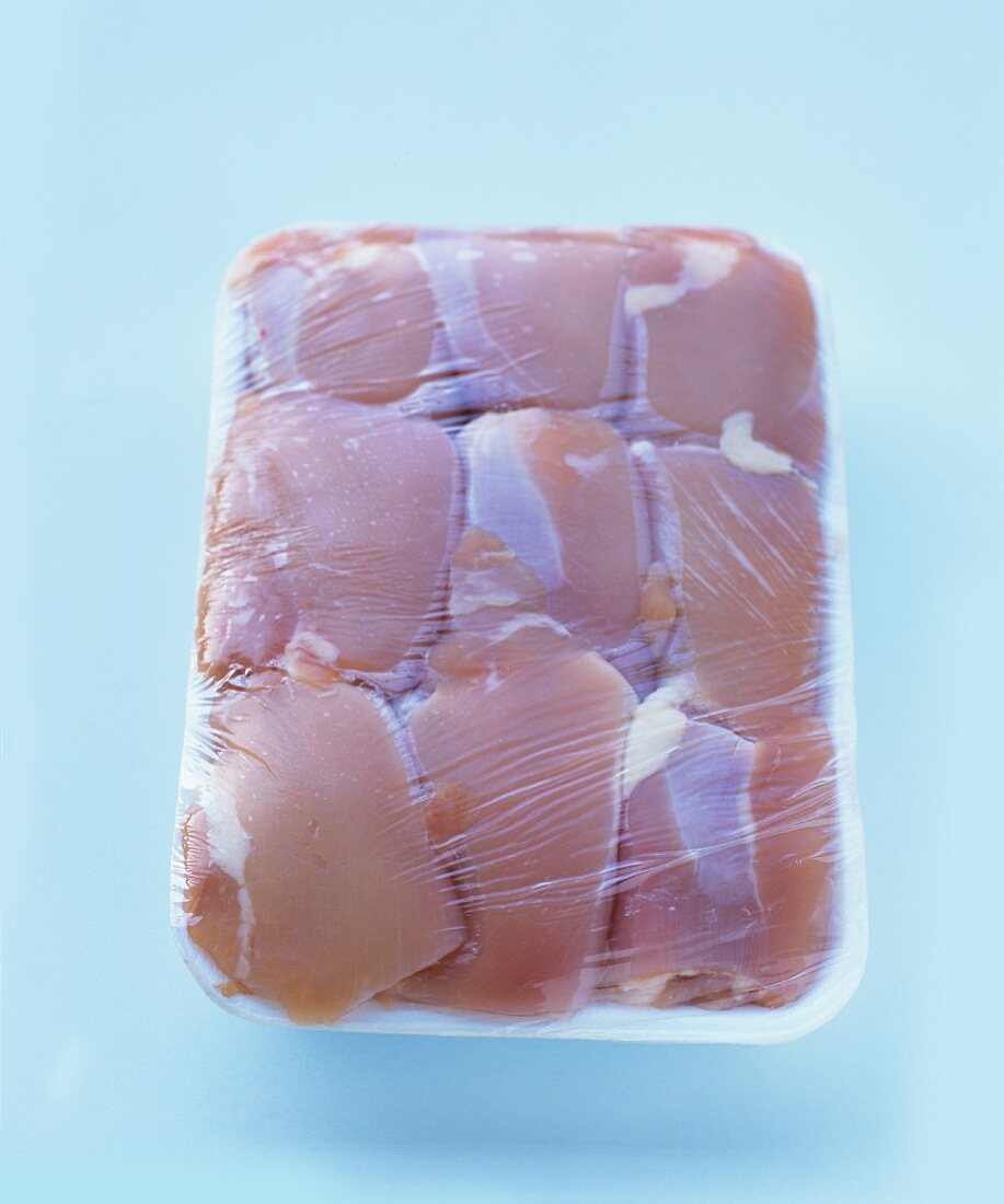 Chicken thighs packaged in styropore