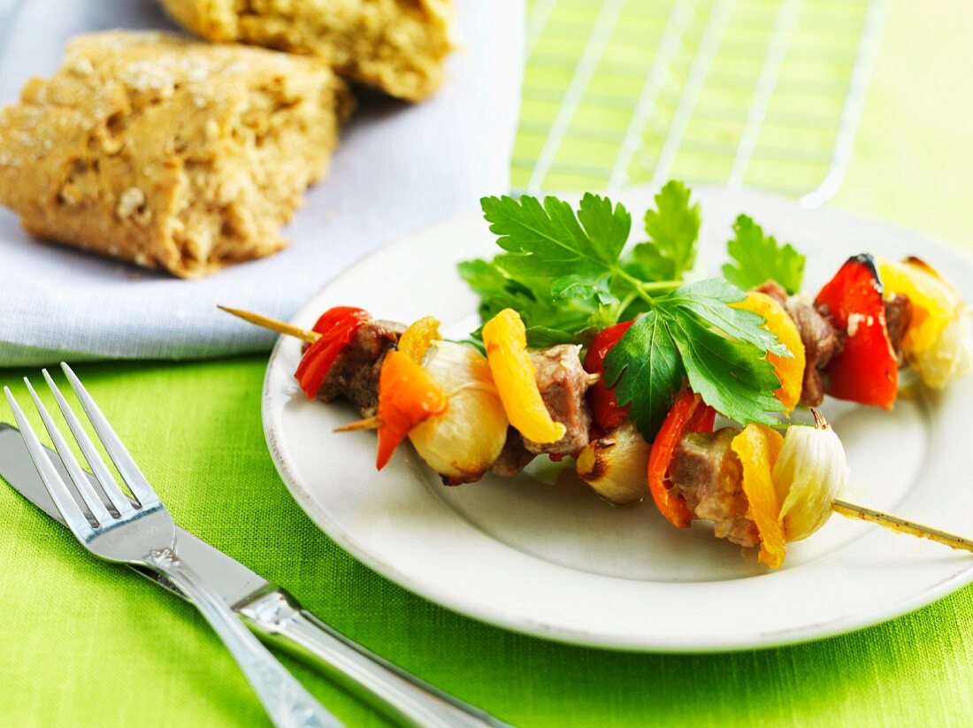 Meat and vegetable kebabs and homemade bread