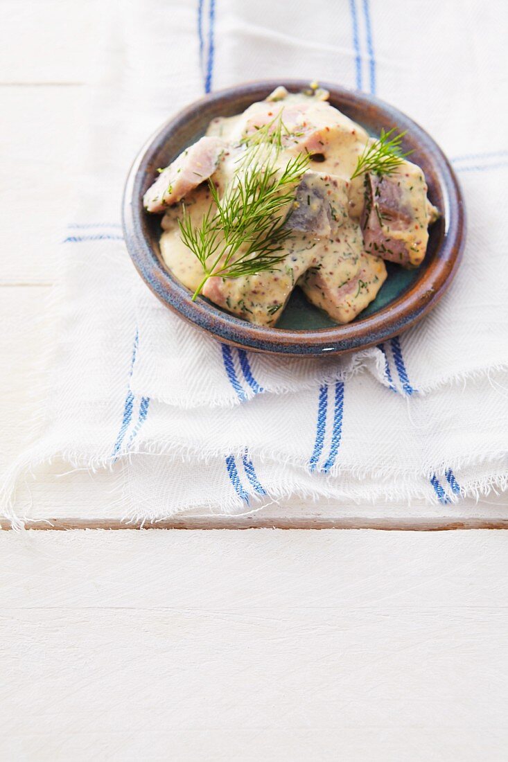Soused herring in a mustard sauce with dill