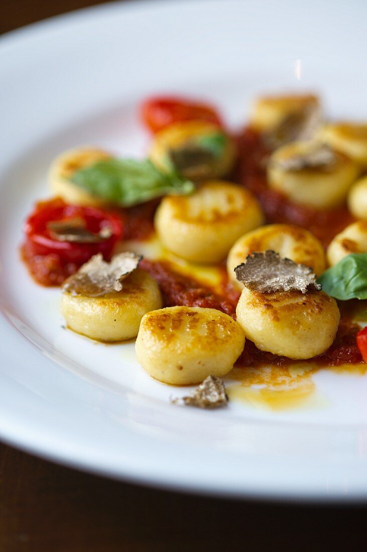 Gnocchi with tomatoes, truffles and basil