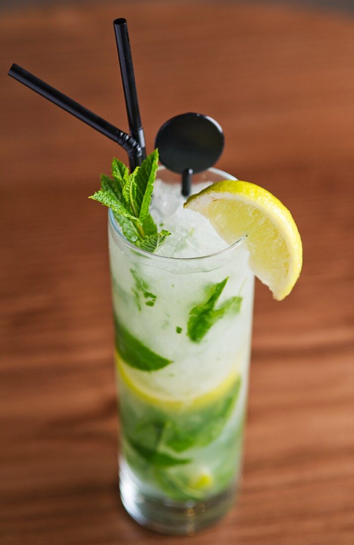 A mojito with mint, ice cubes and lemon