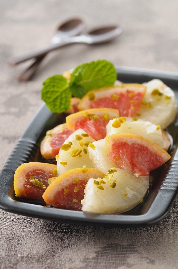 Sugared fruits with pistachios and mint