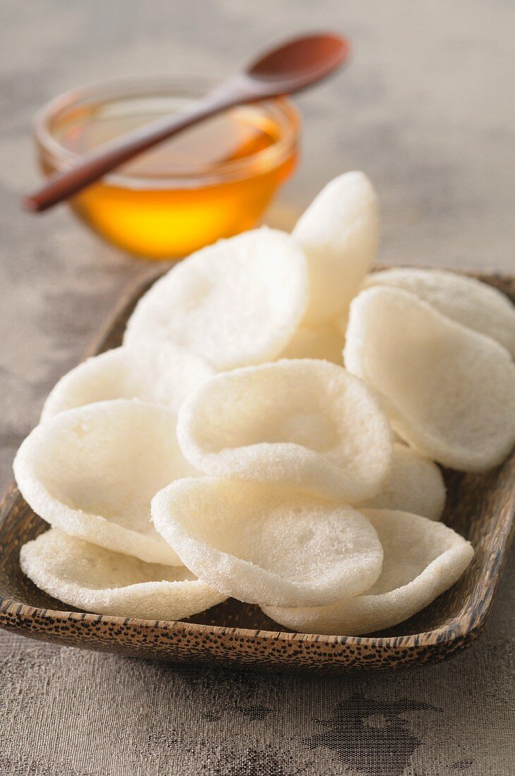 Prawn crackers in a wooden dish