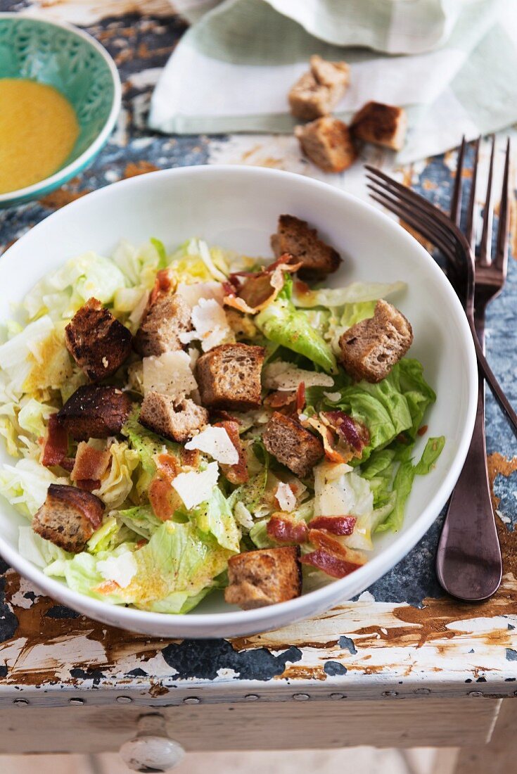 Caesar salad with bacon, croutons and Parmesan