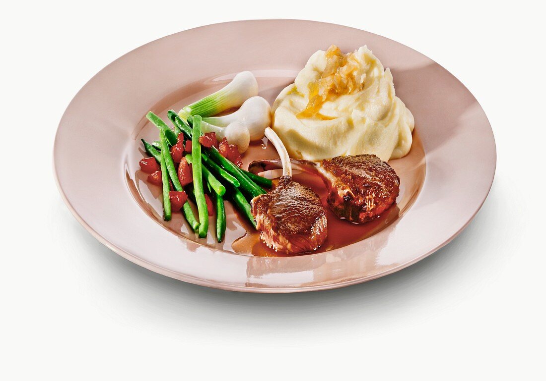 Lamb chops with mashed potato, green beans and spring onions