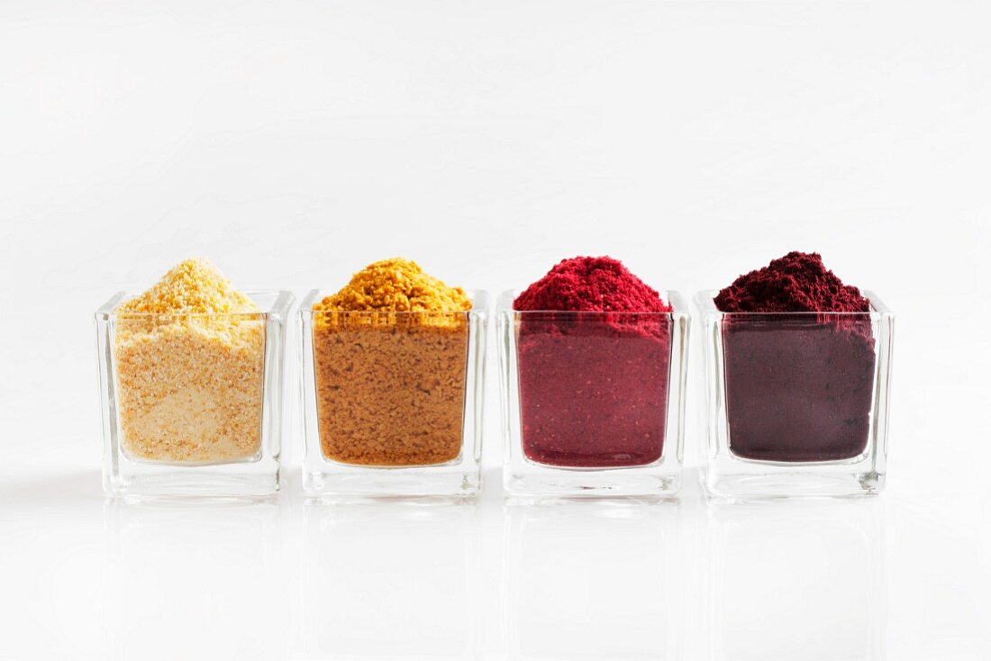 Four types of fruit powder in glasses