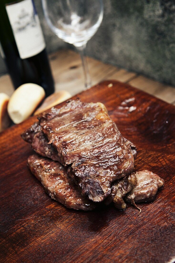 Grilled meat, bread and red wine