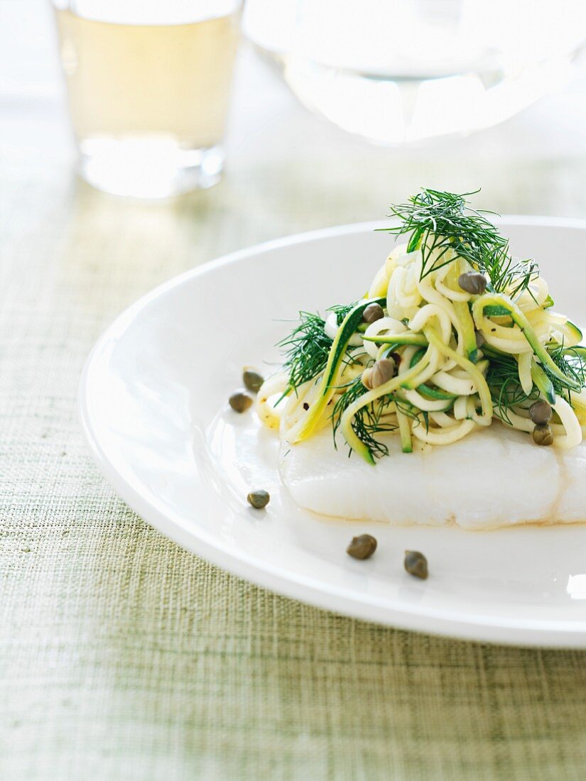 Poached cod with courgette pasta and dill