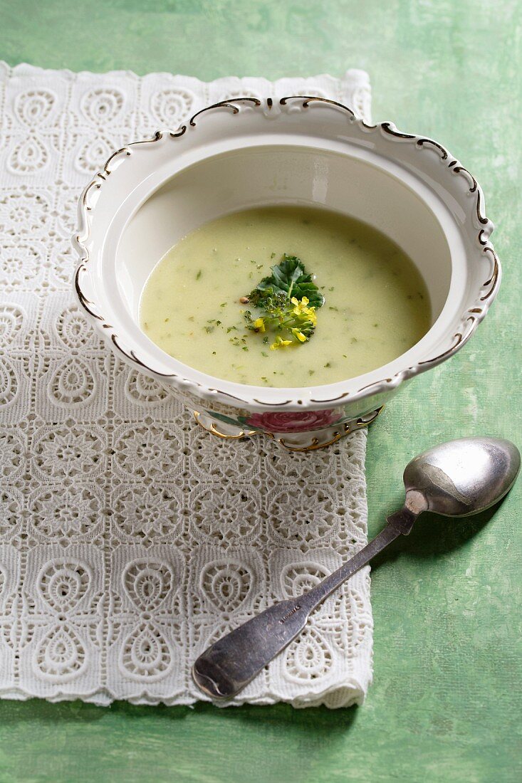 Cream of broccoli soup garnished with broccoli flowers