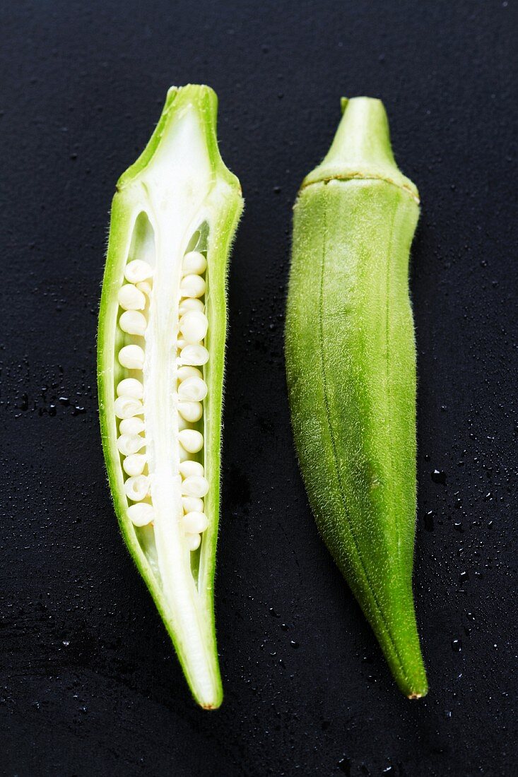 Okra pods, whole and halved