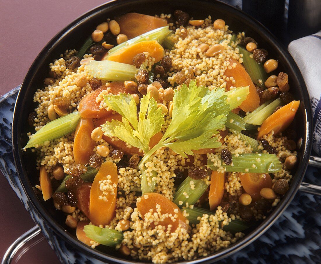 Millet stew with raisins, peanuts, carrots & celery