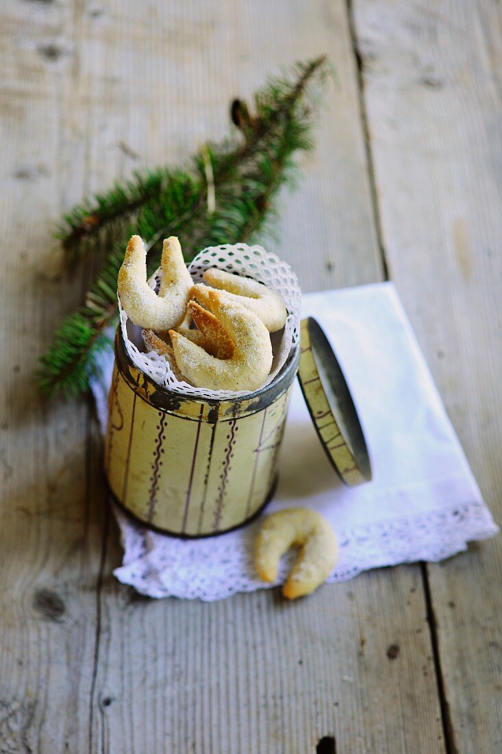 Vanillekipferl (cresent-shaped vanilla biscuits) in a biscuit tin