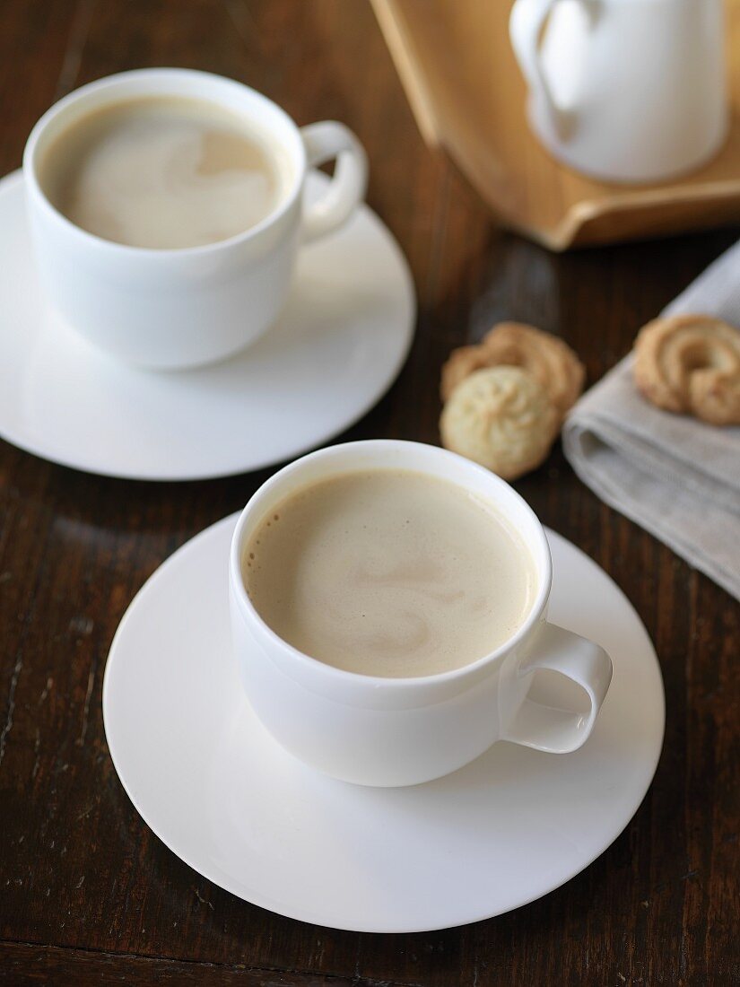 Two cups of latte with milk foam