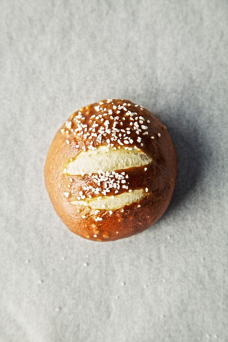 A lye bread roll (seen from above)