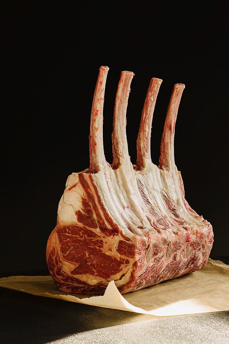Tomahawk rack of ribs (a rack of beef ribs with extra long bones)