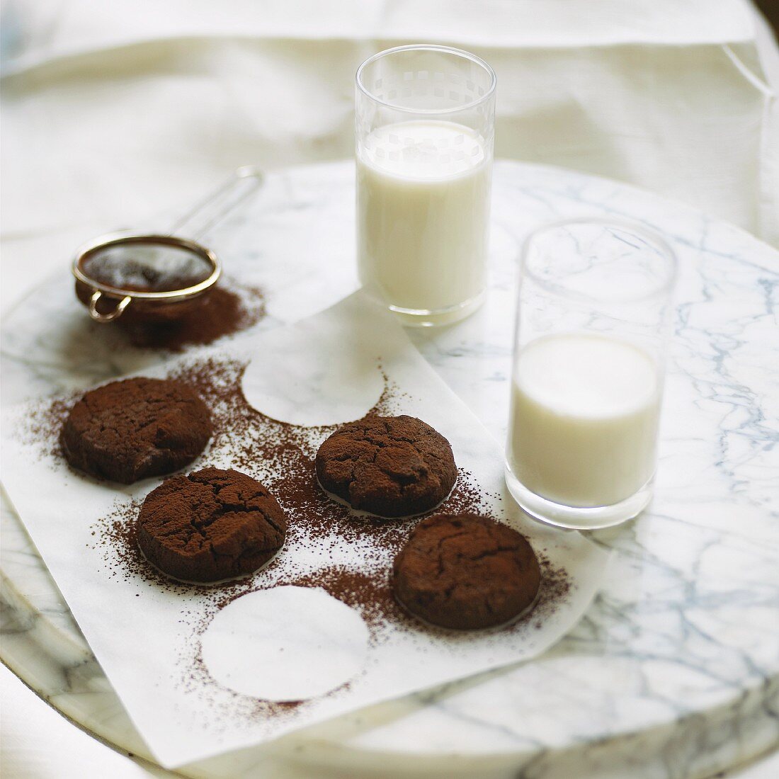 Chocolate cookies and two glasses of milk