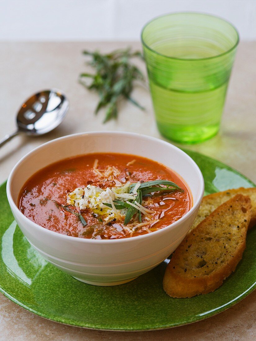 Tomato soup with tarragon and grated cheese