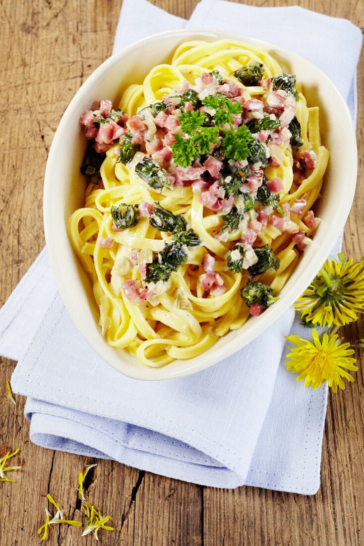 Tagliatelle with bacon and dandelions