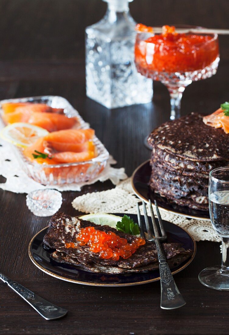 Buckwheat pancakes with red caviar and smoked salmon