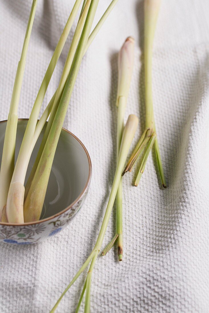 Lemongrass in a bowl and on a tea towel