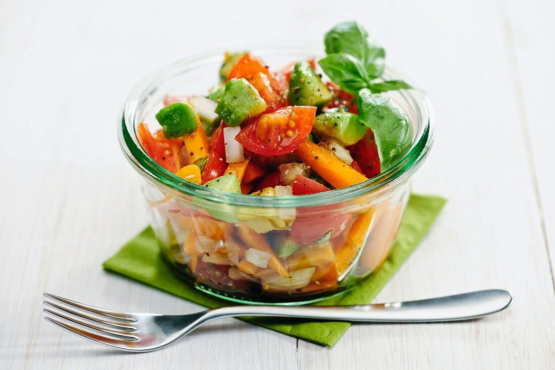 A summery vegetable salad with tomatoes, avocado and carrots