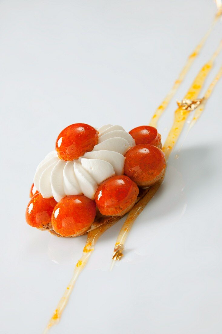 A Saint Honoré cake with a mandarin glaze
