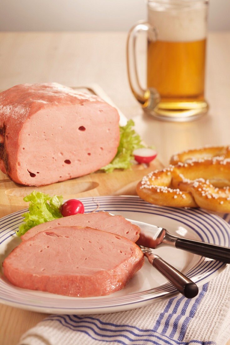 Leberkäse (beef and pork meatloaf), a pretzel and a glass of beer