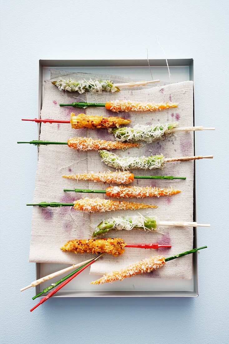 Coconut carrots, asparagus tips with Parmesan and crispy corn cobs with Chile