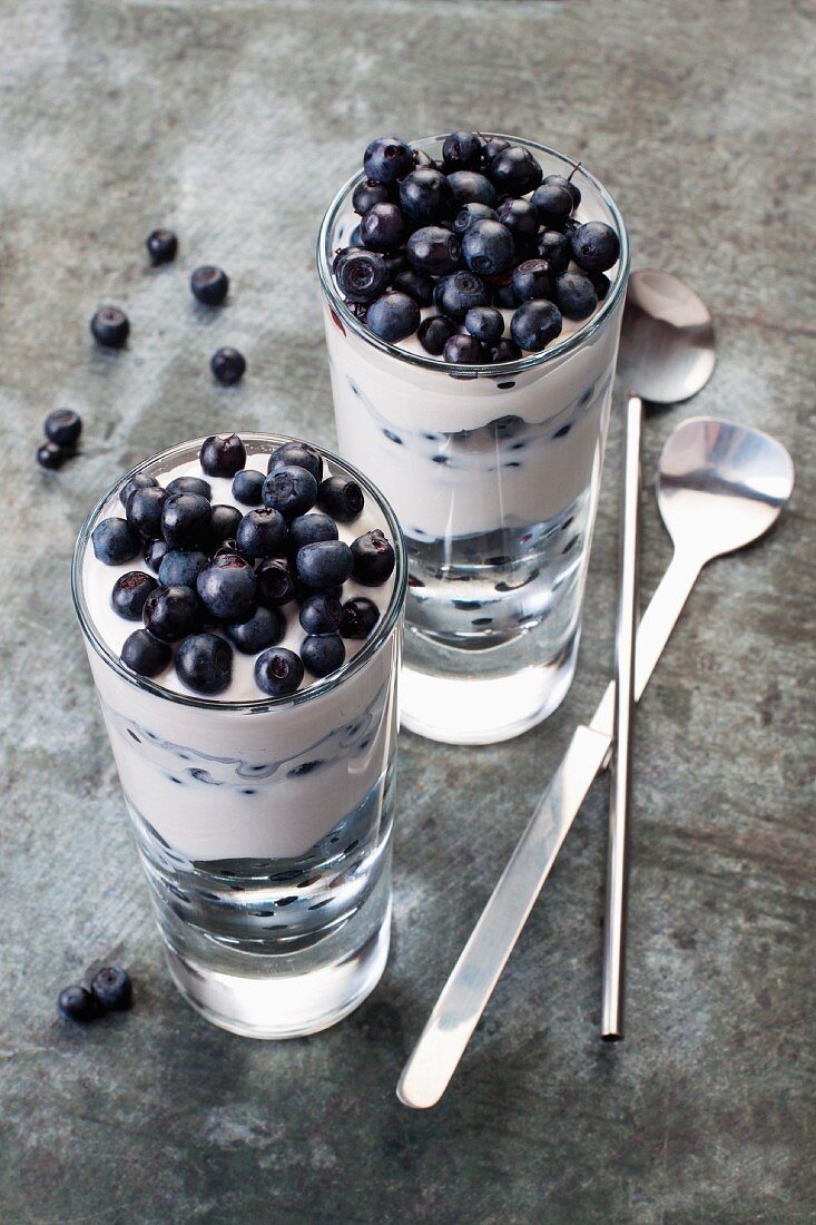 A cream dessert with blueberries