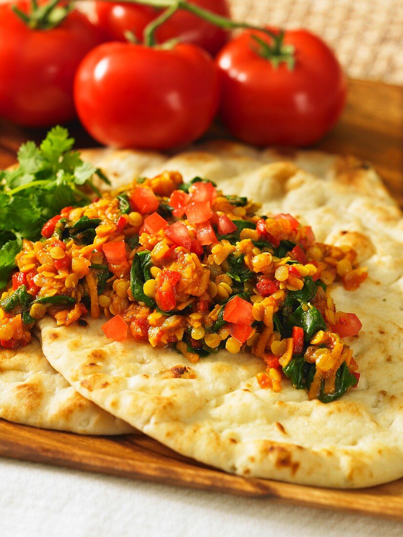 Red lentil curry on unleavened bread