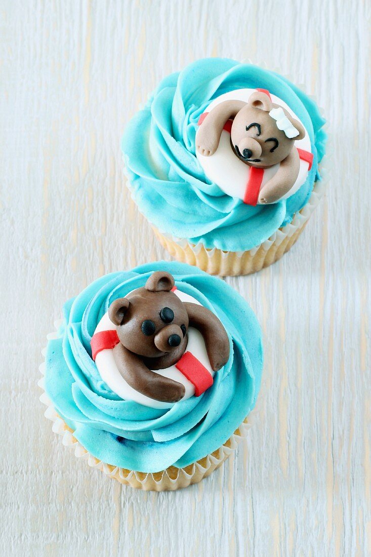 Coconut cupcakes decorated with swimming teddy bears