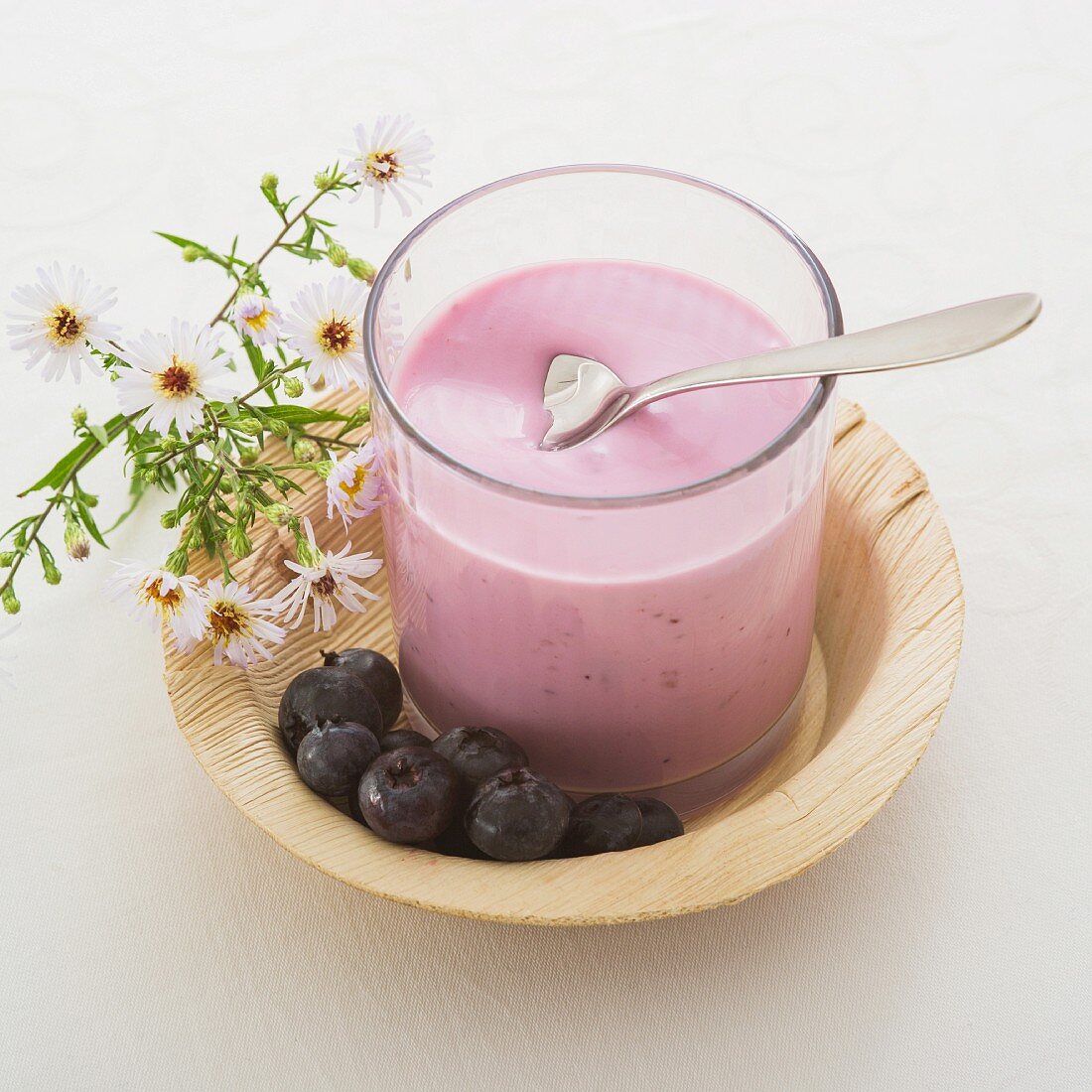 A glass of blueberry yogurt