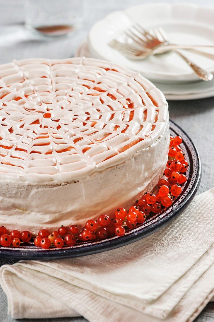 A vanilla cream cake with redcurrants