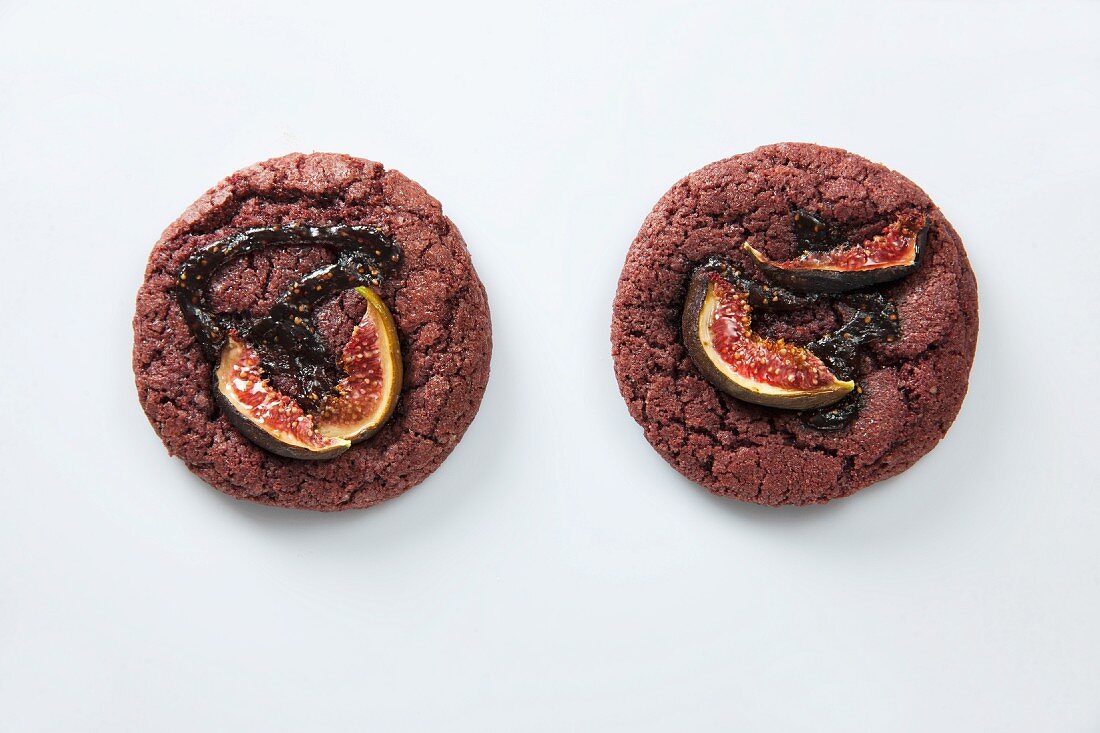 Two chocolate cookies with figs