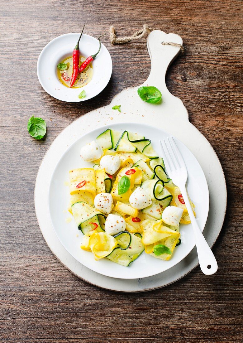Courgette salad with mozzarella, chilli Ppeppers and basil