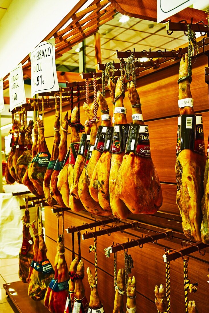 Serano ham hanging in a shop