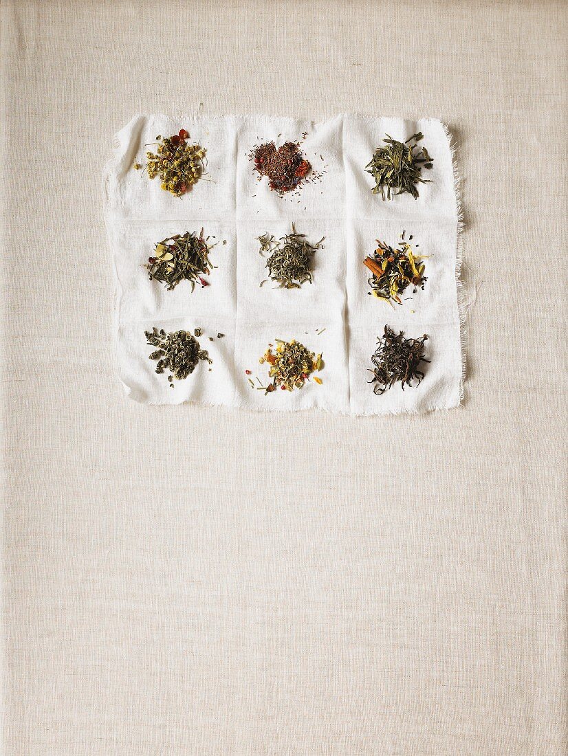 Various types of teas on a white cloth