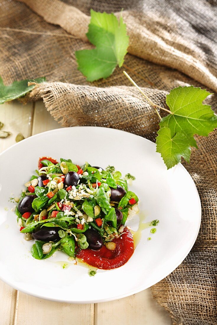 Spinach salad with black olives and feta cheese