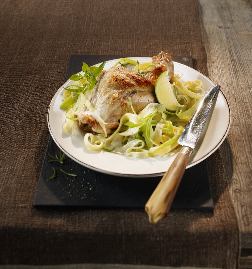 Rabbit leg with a lime sauce and leek tagliatelle