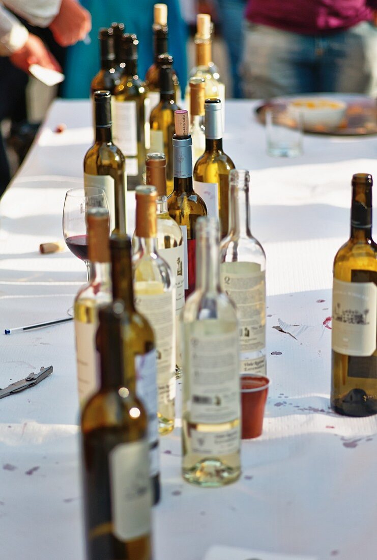 Empty wine bottles on a cleared table (Portugal)